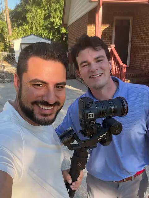 Kerlie with an agent on set